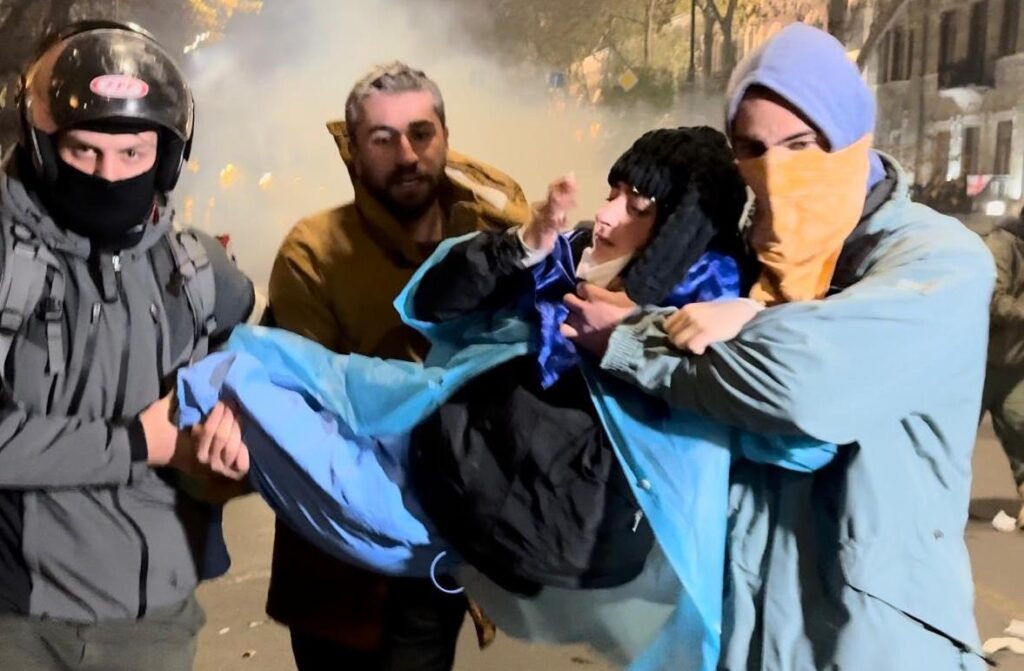A demonstrator intoxicated by tear gas during anti-government demonstration in Tbilisi, December 2024 | Masho Lomashvili