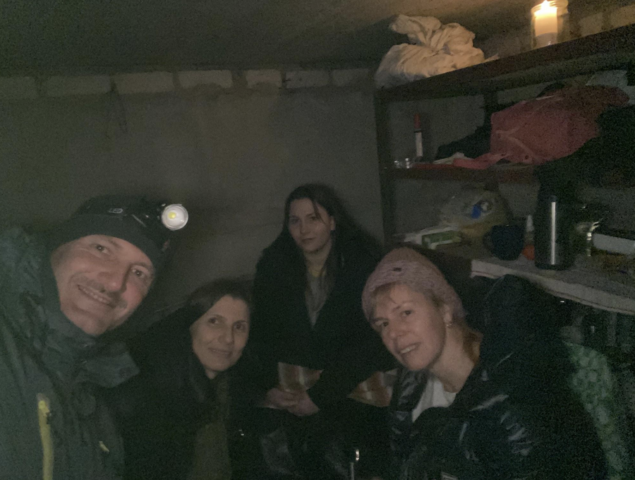 Svitlychna with her classmate's family in basement | Photo: courtesy of MS